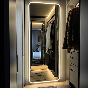 Full-length illuminated mirror in a walk-in wardrobe
