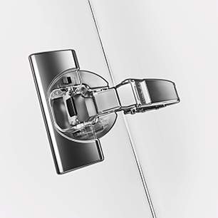 Concealed cabinet hinge mounted on a door