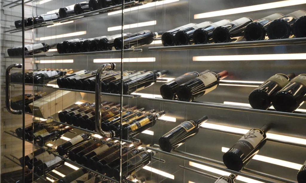 Close up of wine cabinet materials, lighting, and shelving