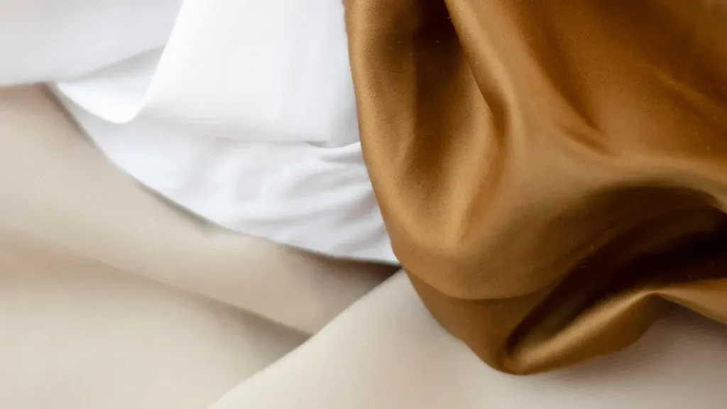 Close up of white and gold fabric folds