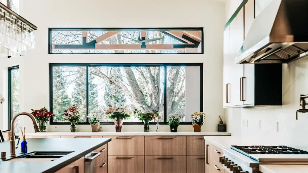 Kitchen with wood finished cabinets and a wide garden facing window