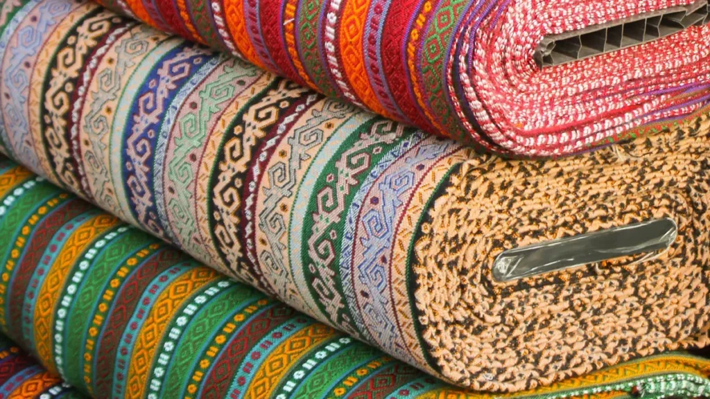Colorful patterned textiles stacked together