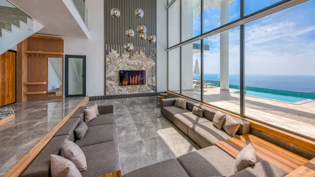 Coastal living room with large windows facing the sea