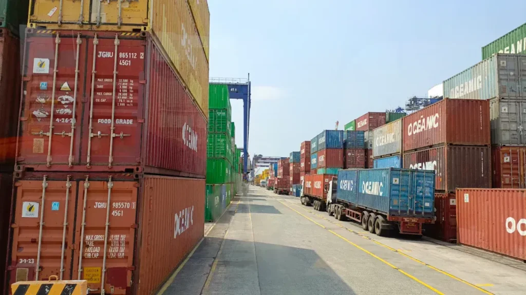 Container terminal with rows of stacked freight containers