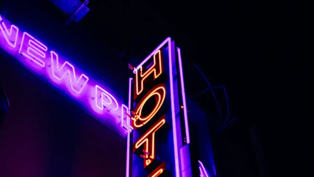 Illuminated neon hotel sign at night
