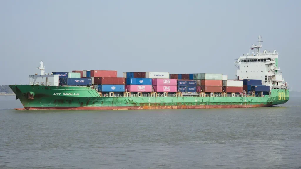 Container ship carrying stacked freight containers