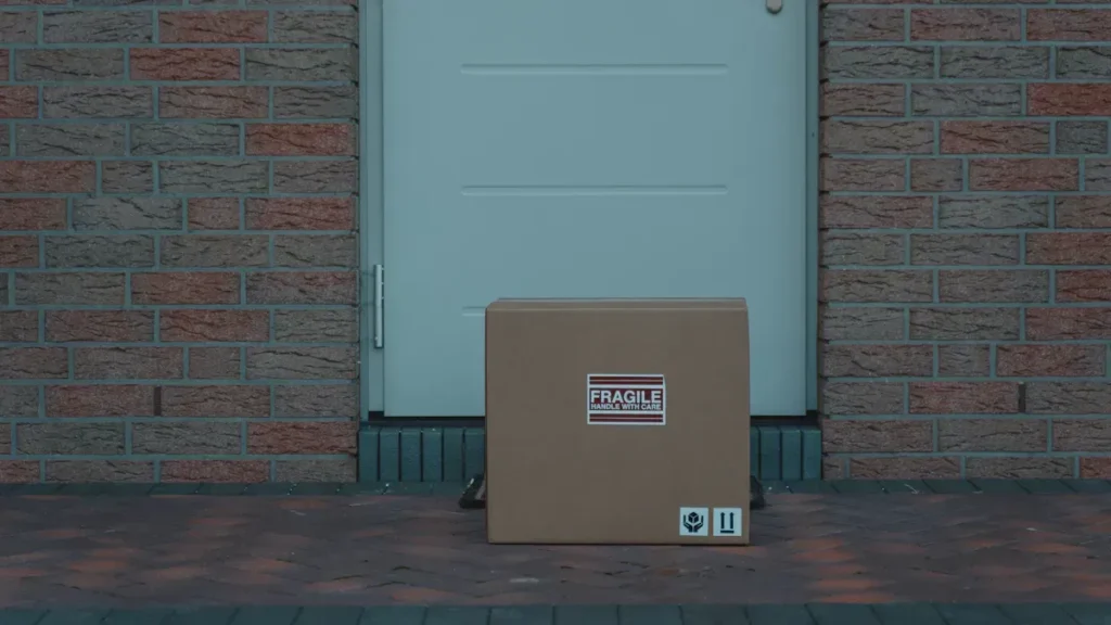 Cardboard package placed outside a front door