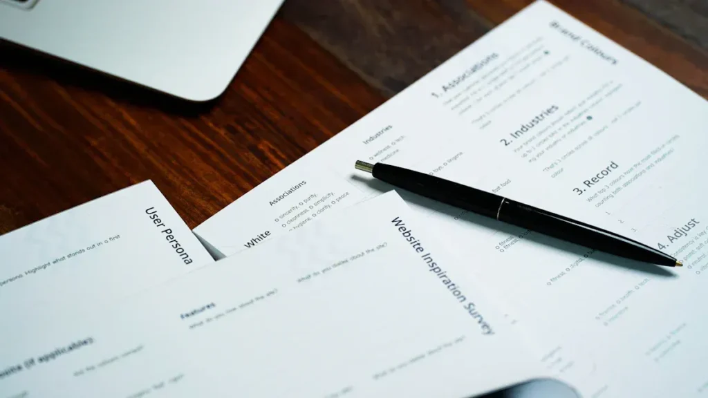 Financial paperwork and a pen on a desk