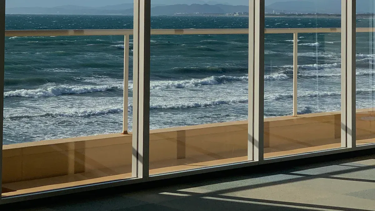 Large sliding glass doors overlooking the sea