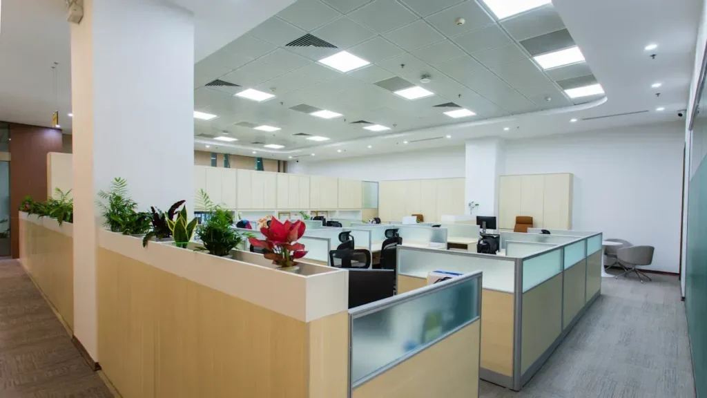 Open office with a grid of ceiling light panels