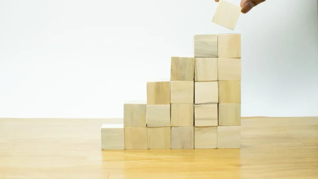 Wooden blocks stacked in the shape of a staircase