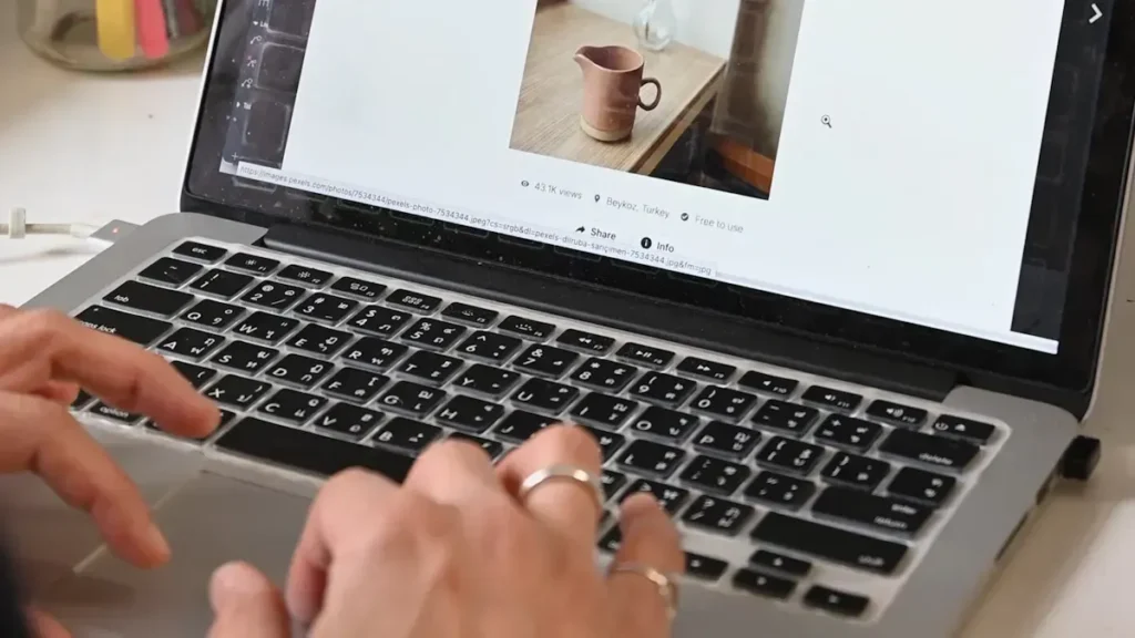 Person browsing a product page on a laptop