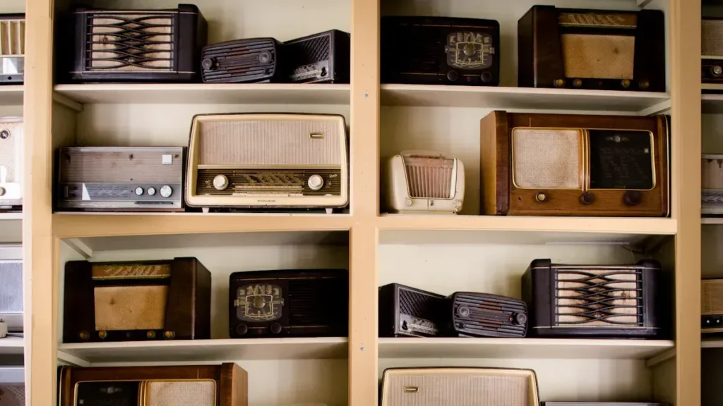 Shelves displaying a collection of vintage radios