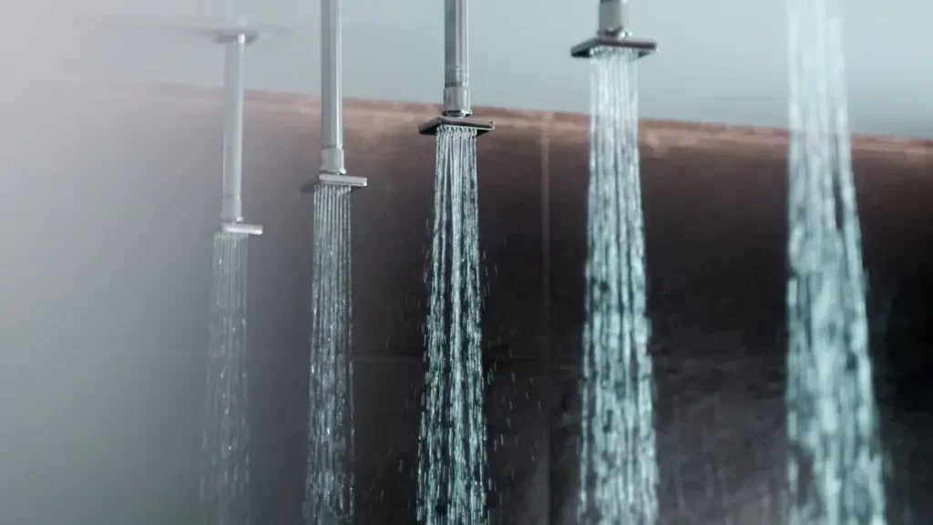 Row of showerheads spraying water