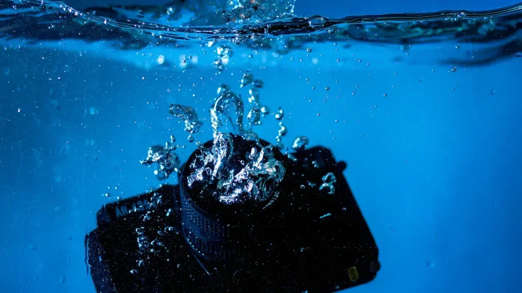 Waterproof device submerged in blue water
