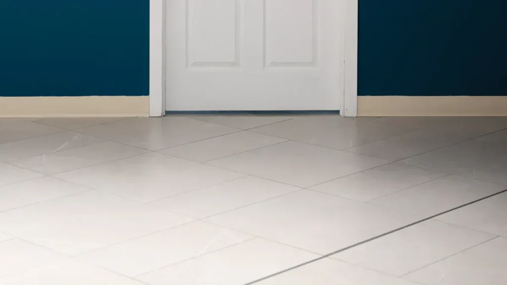 White door with matching trim beside a blue wall