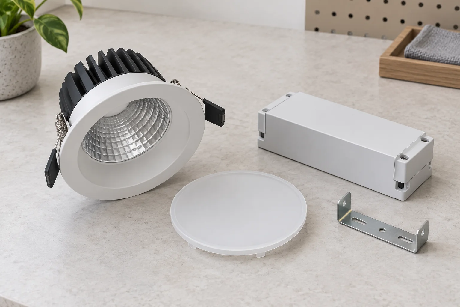 Separate downlight body, frosted disc, closed rectangular enclosure and plain metal bracket