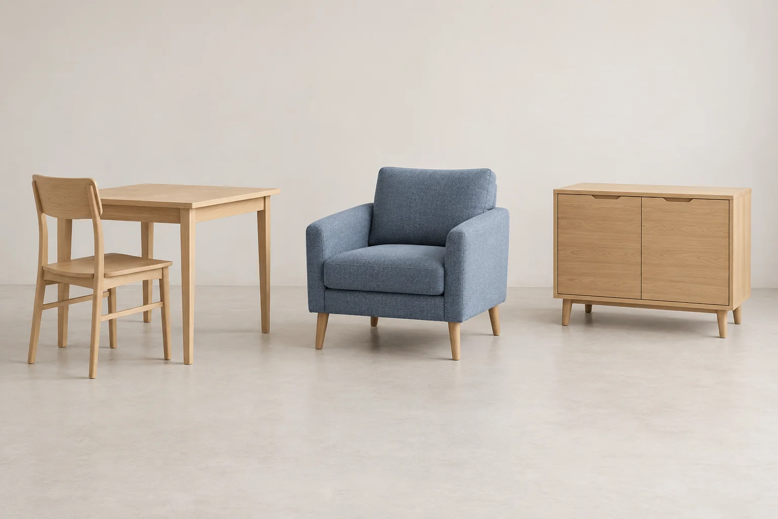 Oak dining table and chair, blue armchair and sideboard in a neutral studio